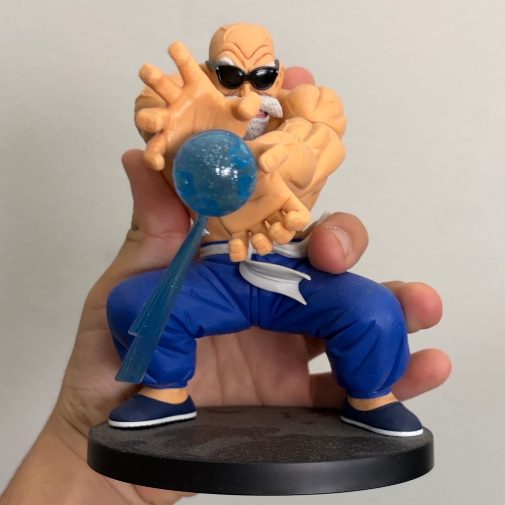 Action Figure with Blue Pants and Energy Ball